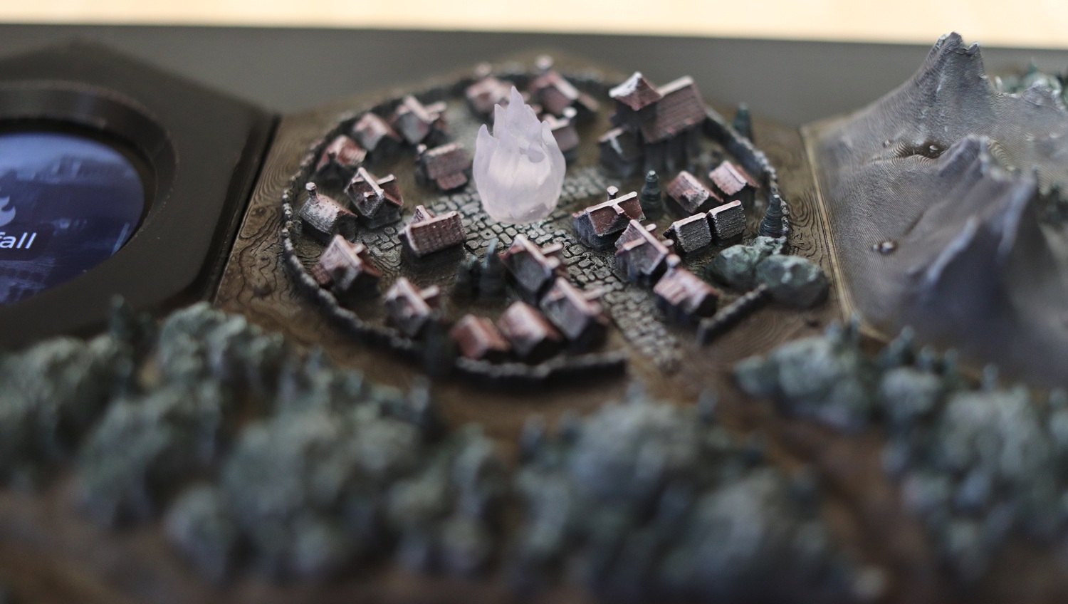 A close-up shot of the Ransfall town hex tile, showing its (unlit) frosted flame cap pyre.