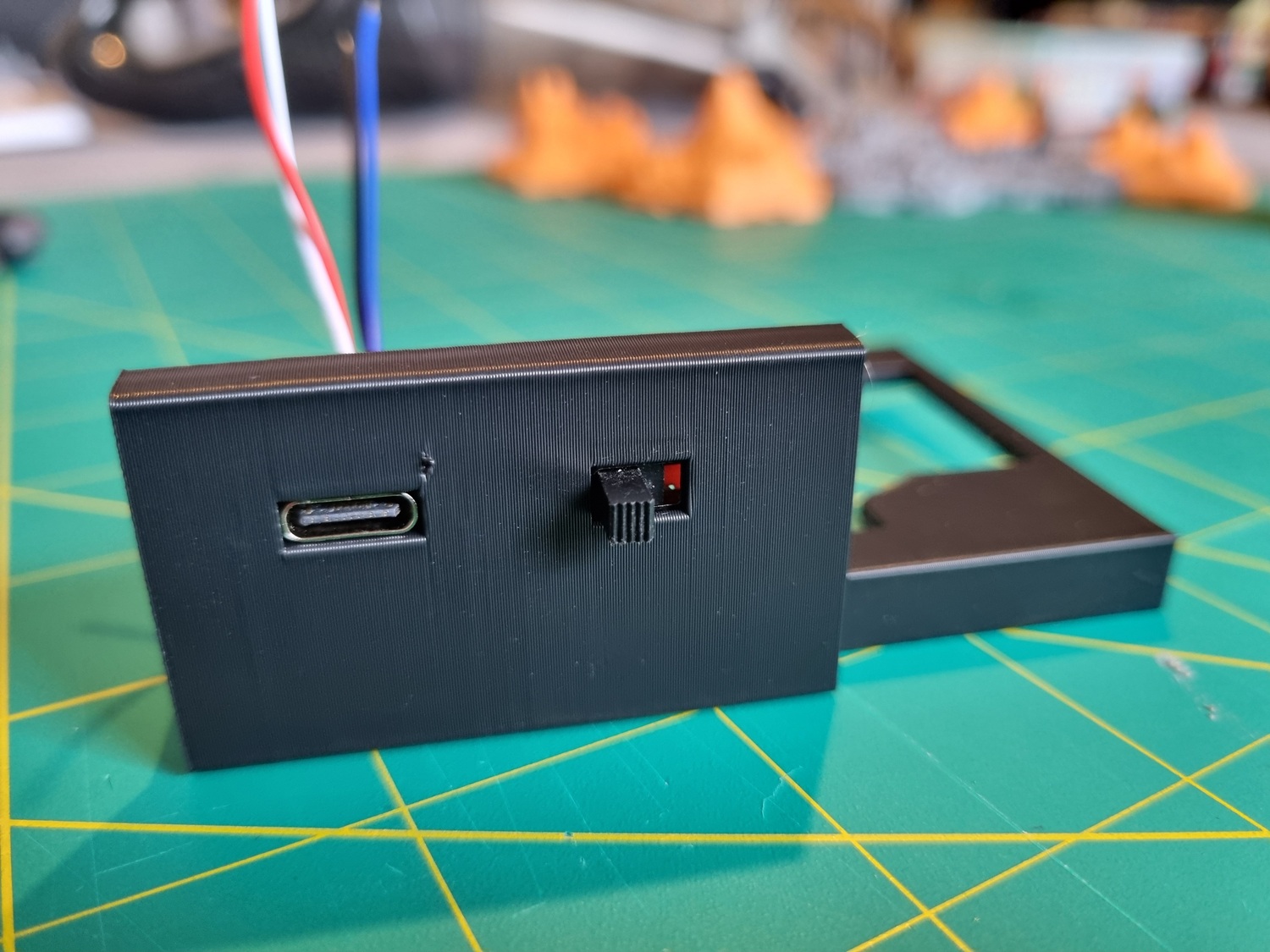 An early prototype test print of a section of the main enclosure showing the USB-C port and power slide switch fitted in their slots, from the front. The USB-C port is flush to the face. An early prototype test print of a section of the main enclosure showing the USB-C port and power slide switch fitted in their slots, from the front. The USB-C port is flush to the face.